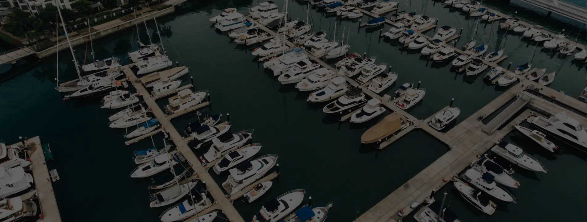 Yacht entering a sheltered European marina