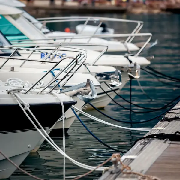 Close view of yacht mooring line and marina cleat